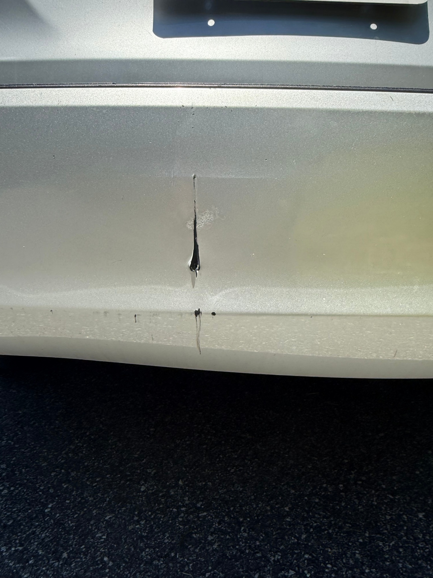 Rear bumper scratch close-up